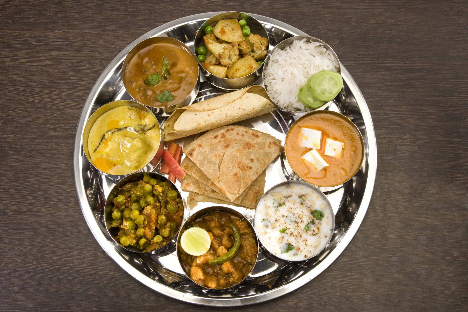A traditional Indian thali with dal, sabzi, rice and roti